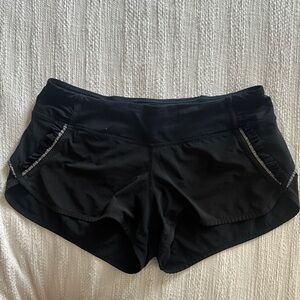 Lululemon- Size 6 Jet Black running Shorts with reflective fringe